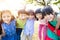 Multi-ethnic group of schoolchildren in park