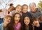 Multi-ethnic group of schoolchildren on school trip, smiling