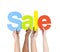 Multi Ethnic People Holding The Word Sale