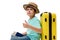 Multi-ethnic teenage boy in blue t-shirt and straw hat with suitcase and boarding pass, shows thumb up looking at camera
