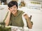 Multi-ethnic Young Woman Smiling Over Financial Calculations