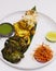 Multi flavored tandoori chicken tikka, cream, saffron and spinach based marinated chicken cubes cooked in clay oven, indian food