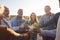 Multi-Generation Adult Family Making A Toast With Alcohol On Winter Beach Vacation