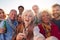 Multi-Generation Adult Family Taking Selfie At Outdoor Party Celebration