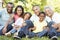 Multi Generation African American Family Relaxing In Park