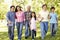 Multi-generation Asian family walking in park