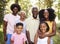 Multi generation black family in a forest, close up portrait