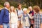 Multi-generation family bonding with each other in a forest