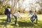 Multi Generation Family Going On Picnic In Park Together