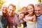 Multi-generation family having fun together outdoors