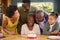 Multi-Generation Family With Military Father Celebrating Birthday With Cake Ay Home