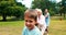 Multi-generation family pulling a rope in tug of war