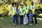 Multi-generation mixed race family collecting garbage