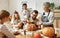 Multi generational family preparing for Halloween in kitchen