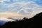 Multi layer of cloud behind mountain during sunset