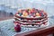 A multi-layer delicious sponge cake with fresh berries