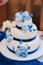 Multi level white wedding cake on silver base and