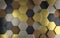 Multi-material Hexagons: A 3D Metallic Tiled Background in gold, copper, aluminum and black alloy material.