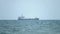 Multi-purpose vessel carrying bulk cargo on deck across sea. Shipping services