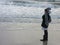 Multi Racial tween girl on beach by ocean