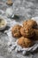 Multi seeds whole wheat rolls on a grey stone background.