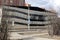 Multi-storey parking after a fire. Copy-darkened windows with burned out cars inside