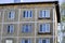 A multi-storey residential building of the Soviet period. Gray faceless windows and walls. Russia.