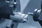 The multi-tasking CNC lathe machine milling cut the metal shaft parts by milling turret