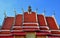 Multi-tier temple roofs under blue sky