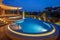 Multi-tiered pool with an integrated bubbling whirlpool bath at night