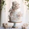 Multi-tiered wedding cake with vintage charm and intricate detailing