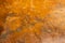 multi toned semi smooth weathered golden orange stucco wall texture background