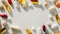 Multi vitamin a diverse assortment of vitamin and mineral supplements scattered on a white surface