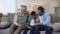 Multiage family members watching photoalbum, strong family bounds, togetherness