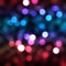 Multicolor bokeh, raining light, blurry lights, blurry background, rainbow confettis on a black background