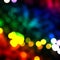 Multicolor bokeh, raining light, blurry lights, blurry background, rainbow confettis on a black background