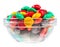 Multicolor bonbon sweets in glass bowl, isolated