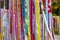 Multicolor bright ribbons hanging outdoors, can be used as a background or decor