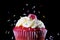 Multicolor candy topping pouring on strawberry delicious cupcake muffin in sugar temptation concept