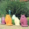 Multicolor ceramic cat statues in the garden