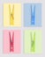 Multicolor clothespins and cards of similar shades on light background, collage. Montessori method