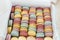 Multicolor fresh macaroons background, close up