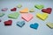 Multicolor heart-shaped origami on desk. Closeup