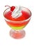 Multicolor jelly dessert with whipped cream and cherry