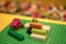 Multicolor Lego blocks and bricks, Early learning. stripe background. Developing toys