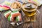 Multicolor marmalade, tea in cup, napkin, sugar in bowl, teaspoon