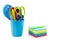 multicolor memo pad and mini container filled with pens and pencils