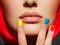 Multicolor nails near closeup girl lips