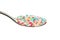 Multicolor nonpareils on a teaspoon