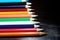 Multicolor pencils on wooden background